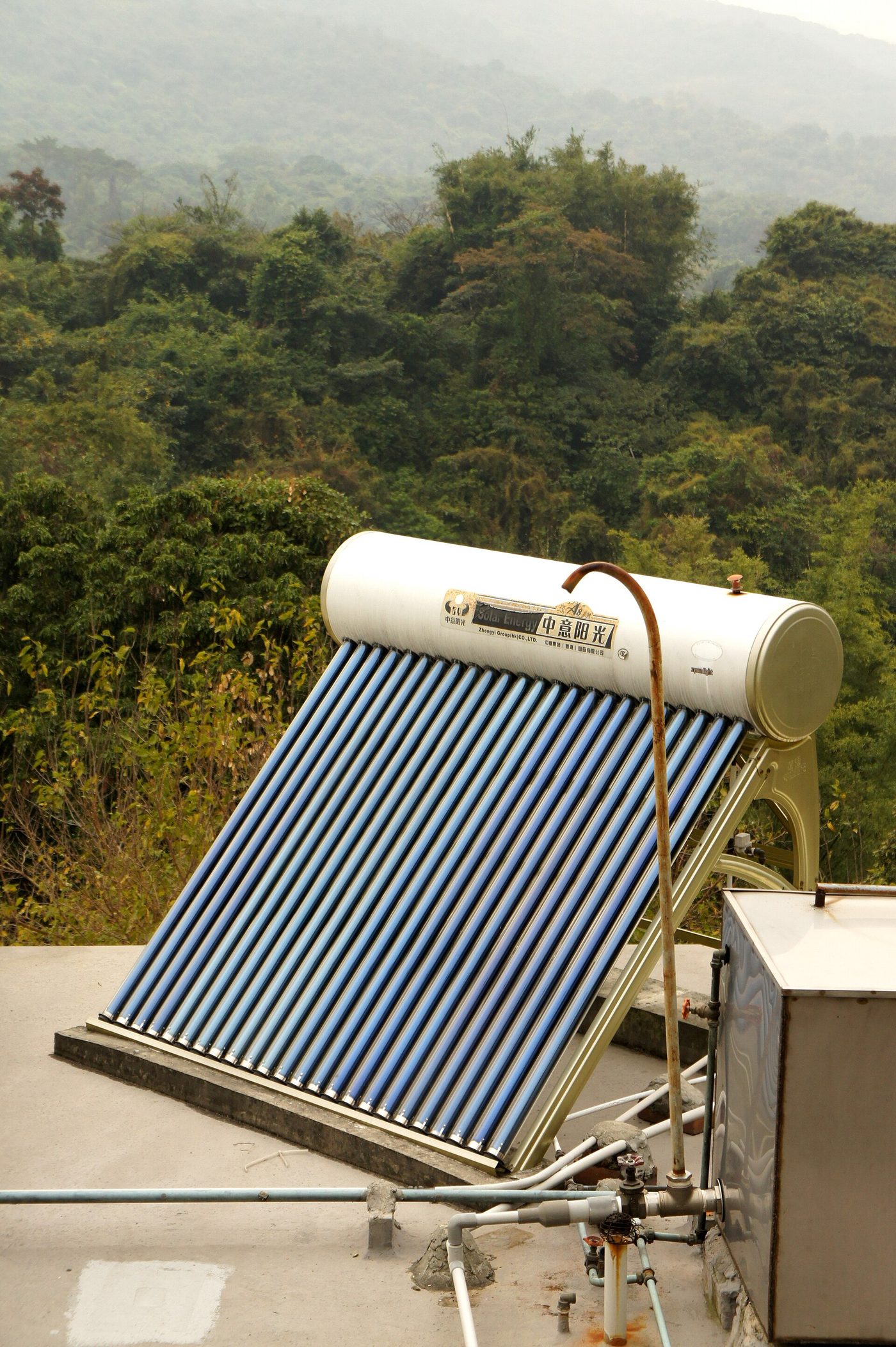 A roof-mounted solar water heater with collector and insulated storage tank