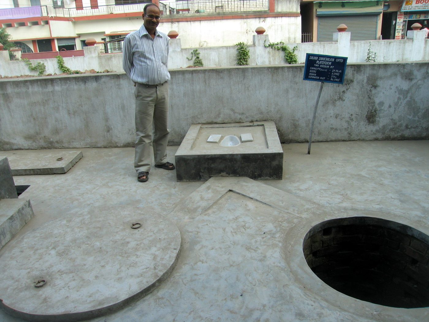 A pour-flush latrine with its squat pan and offset pit covers