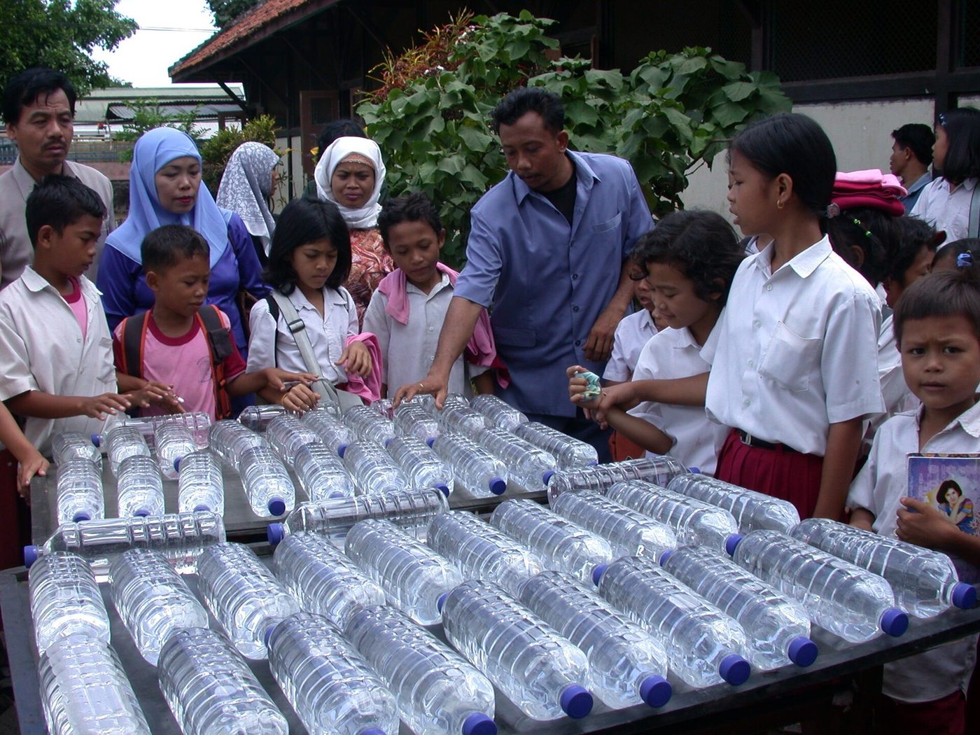 Clear PET bottles laid out in full sun for solar water disinfection